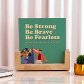 Double-sided frame with motivational quote 'Be Strong, Be Brave, Be Fearless' on green background, set in a wooden base for desk display.